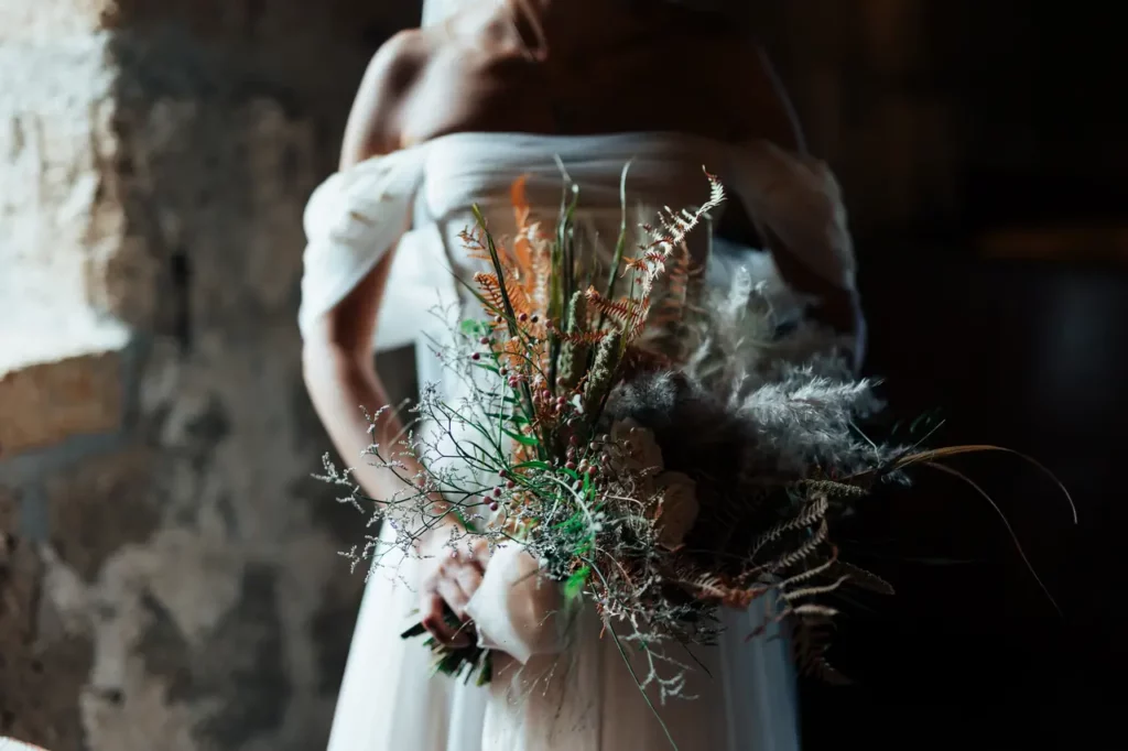 Close-up of the bride's bouquet as she carries it