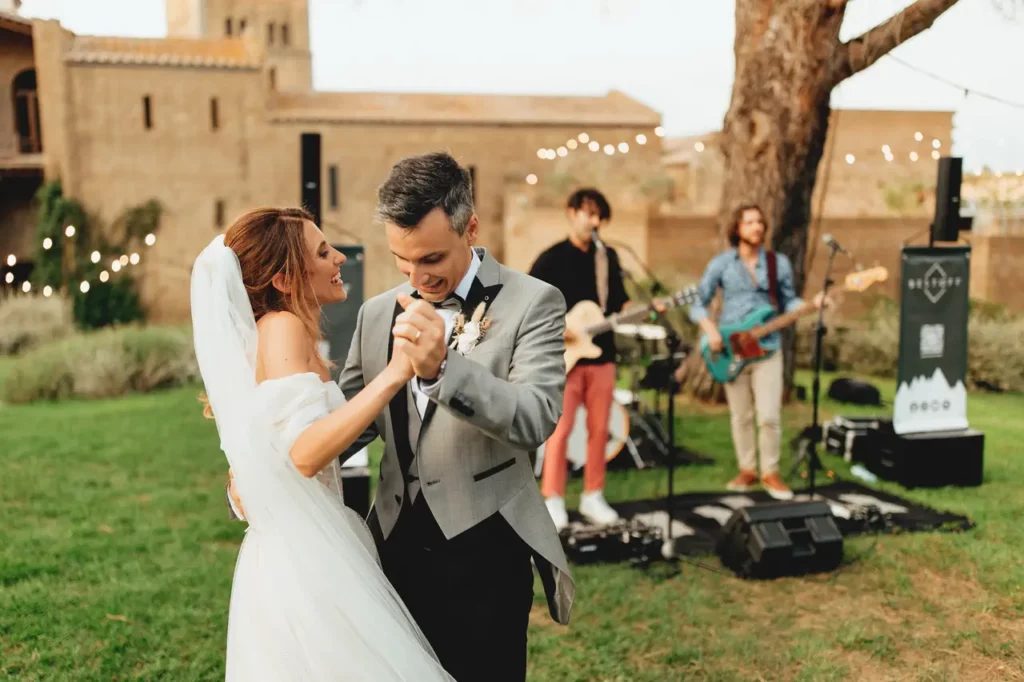 The bride and groom dance happily during the aperitif