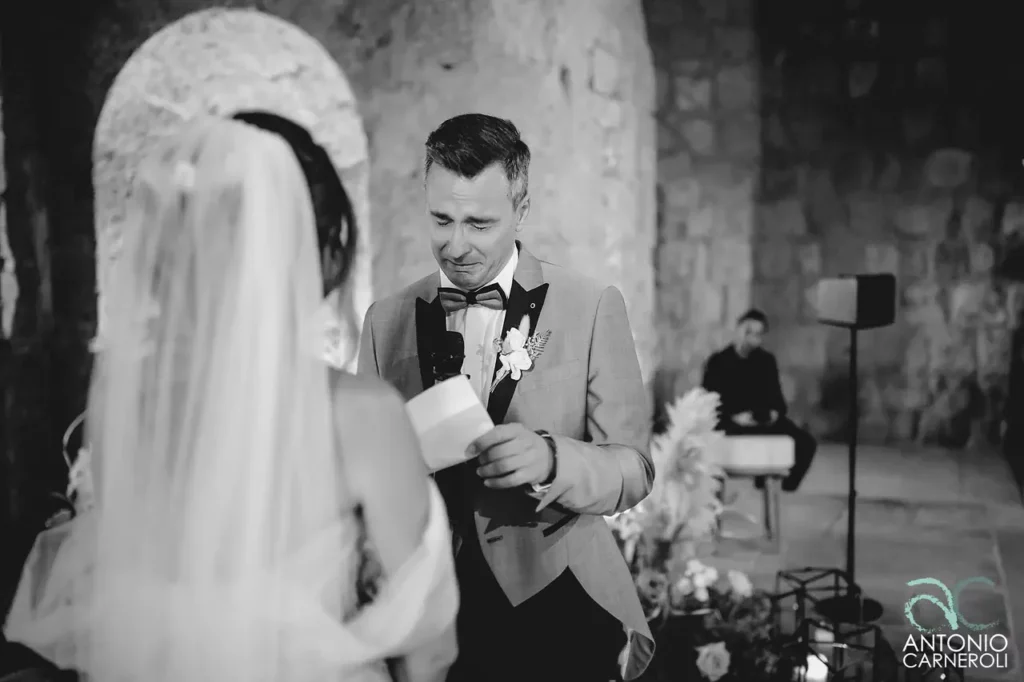 The bride and groom exchange wedding vows at the Abbey of San Giusto, an enchanting location in Tuscania.