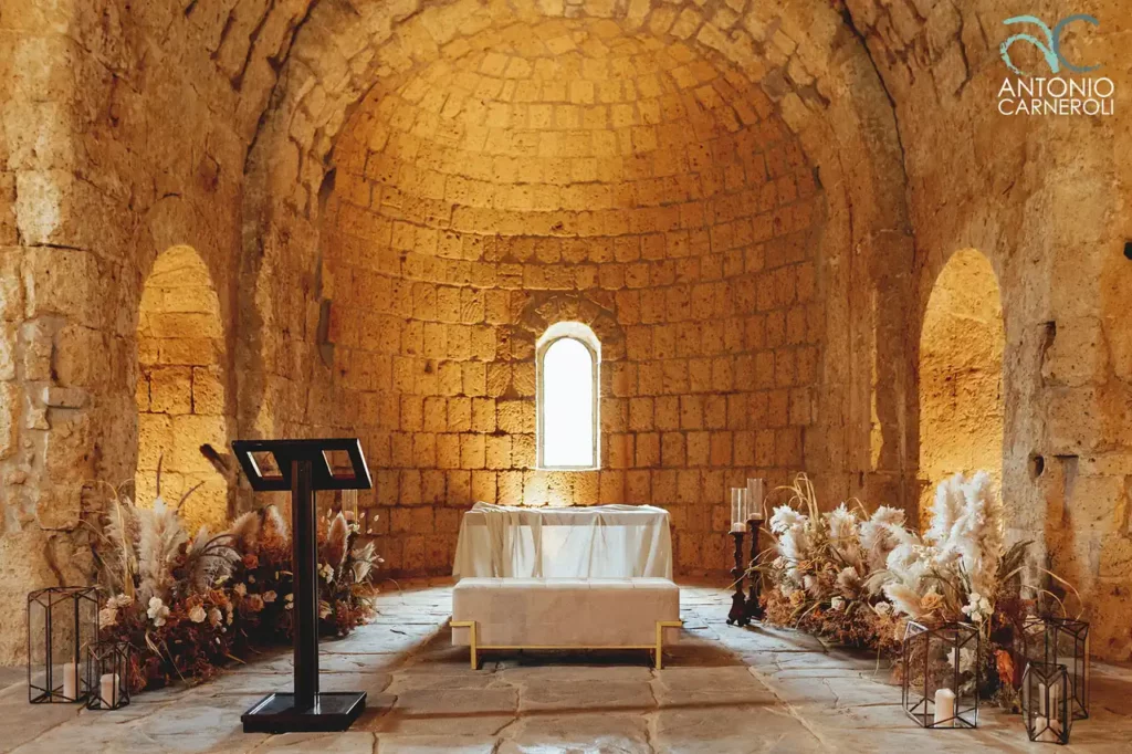 The wedding ceremony in the Church of San Giusto, an ancient stone building in Tuscania.