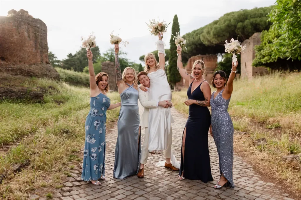 A joyful bride with her bridesmaids, all with flower bouquets and outdoor celebrations.