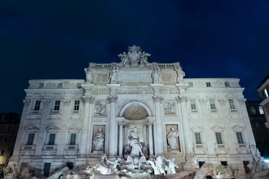 The Trevi Fountain in Rome illuminated at dawn.